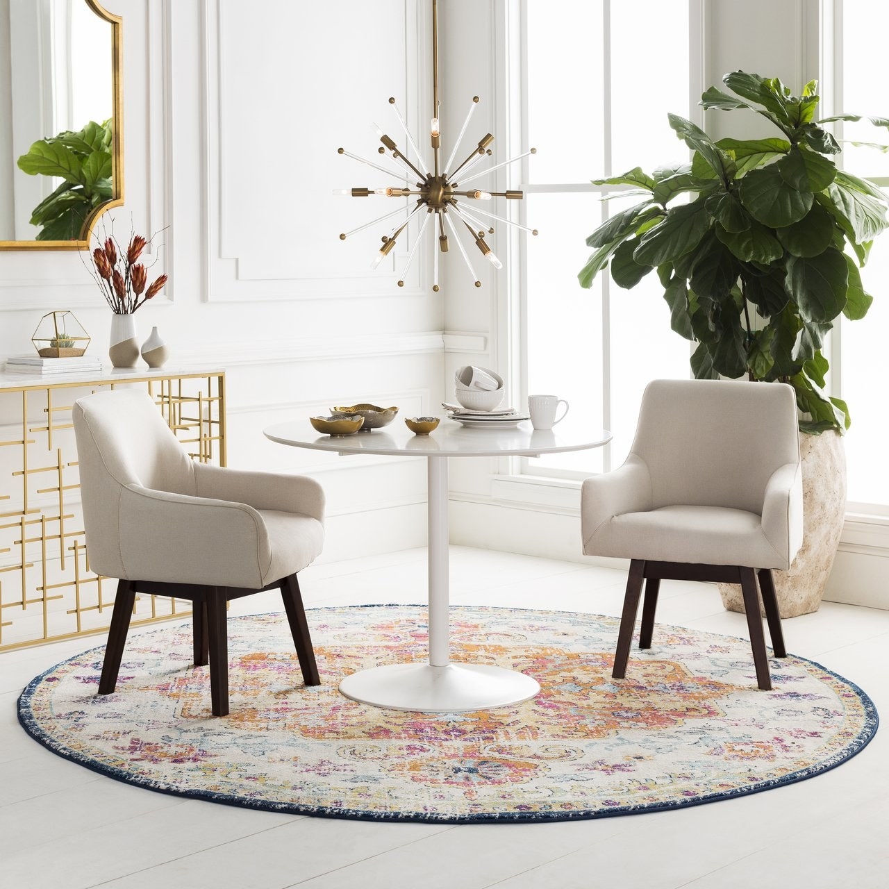 pattern round throw rug under dinner table and chairs