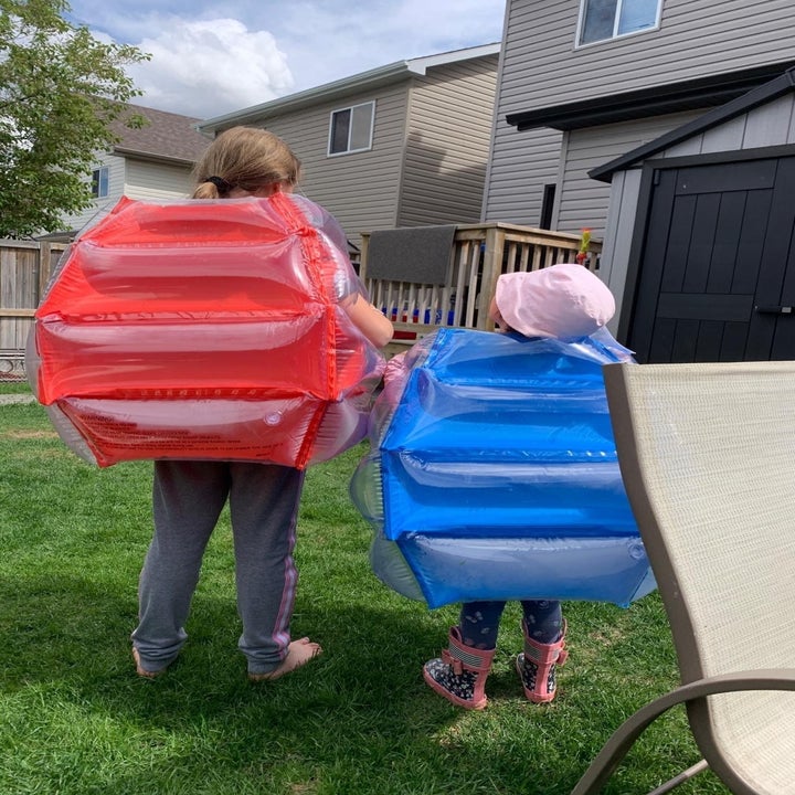 Reviewer's children wearing the body bumpers