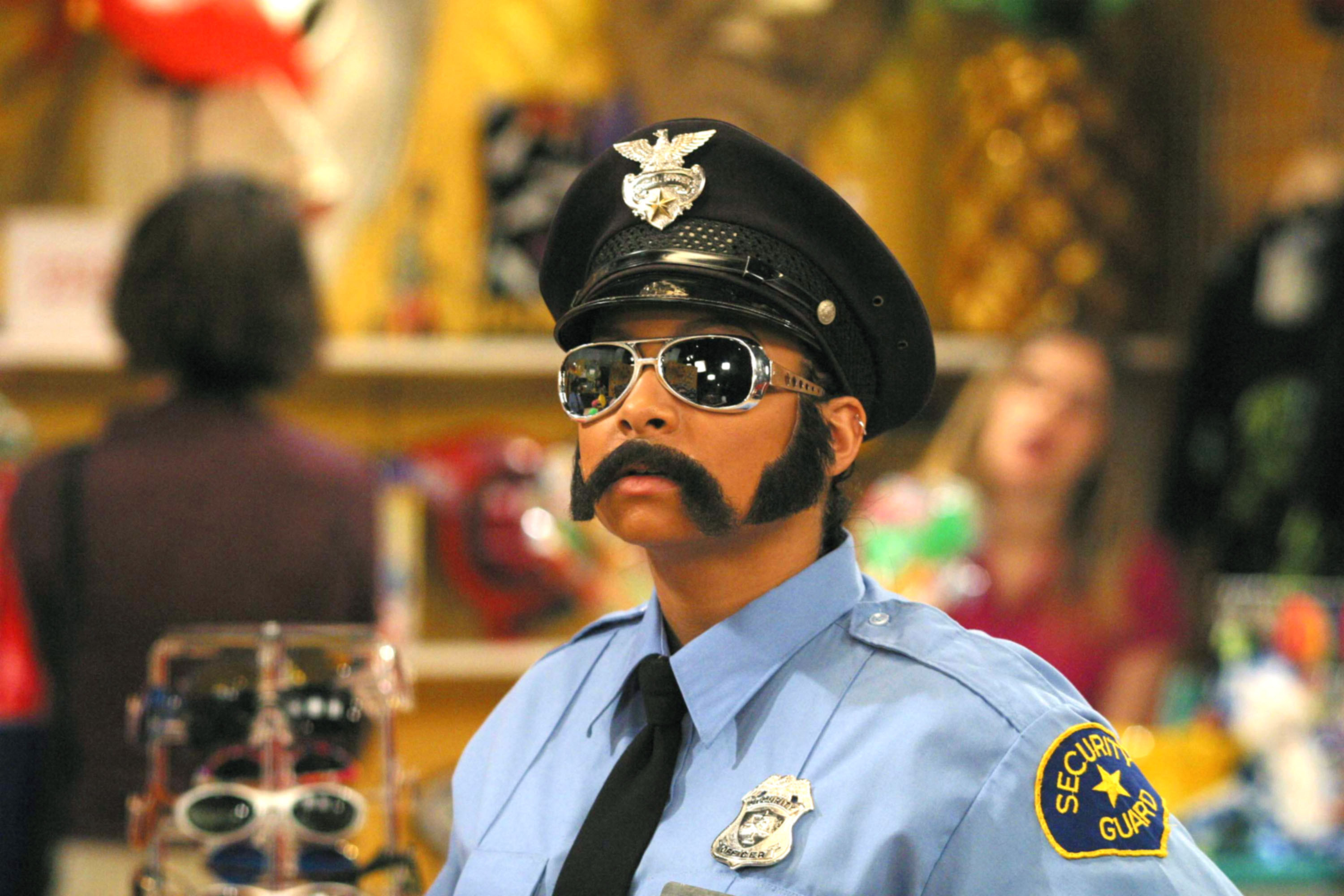 Raven-Symoné dressed up like a male cop