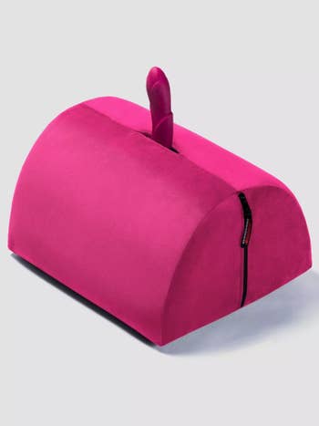 Pink semi-circle pillow with pink vibrator