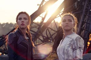 Scarlett Johansson and Florence Pugh in Black Widow. They're wearing battle suits and standing in front of rubble, looking towards the camera but not at it. (CREDIT: Marvel Studios)
