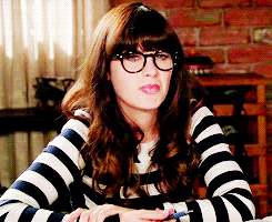 GIF of Zooey wearing glasses and nodding