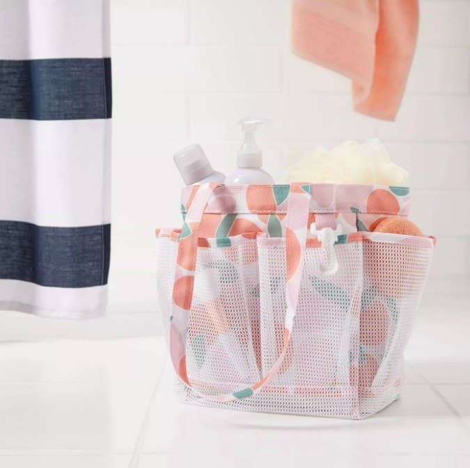 The multicolored caddy holding shower supplies