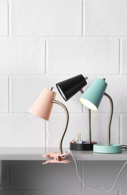 The pink lamp clipped to a desk