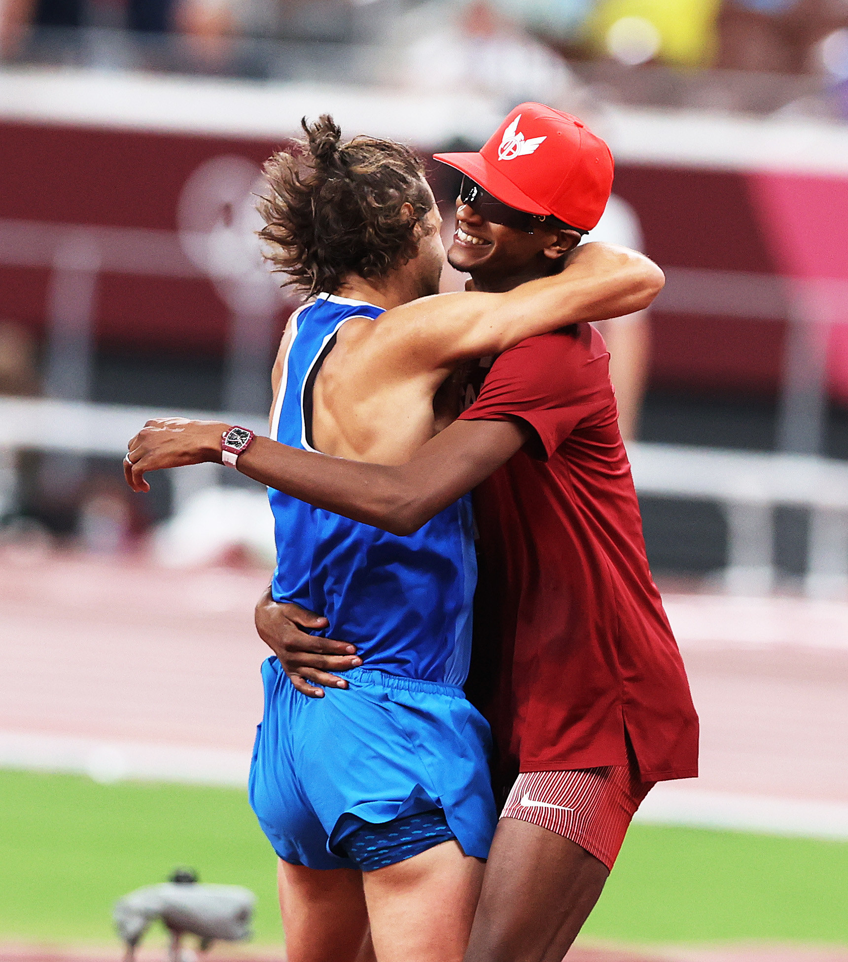 Tamberi and Barshim embrace