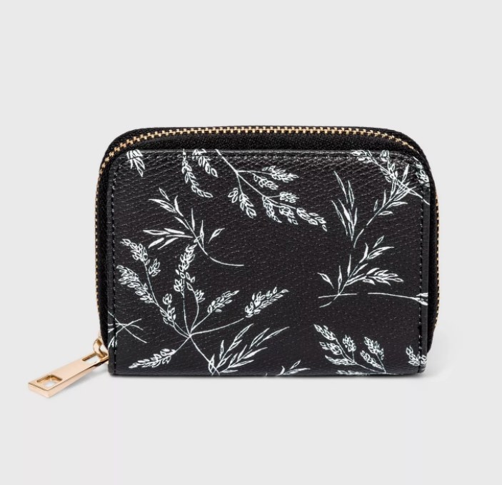 the black wallet with white flowers on it