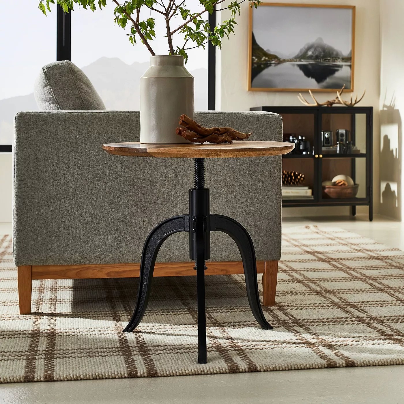 The round table with curved metal legs in a living room