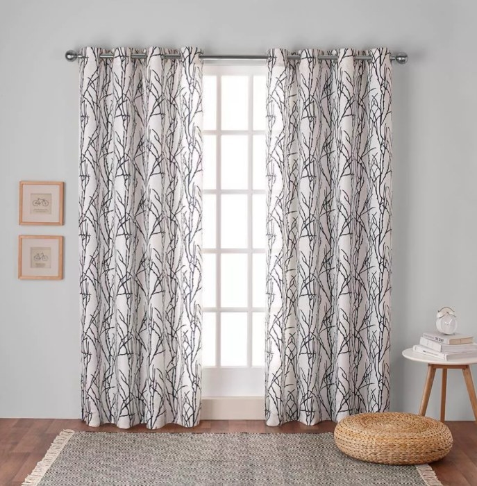 the window curtains in white with black line patterns