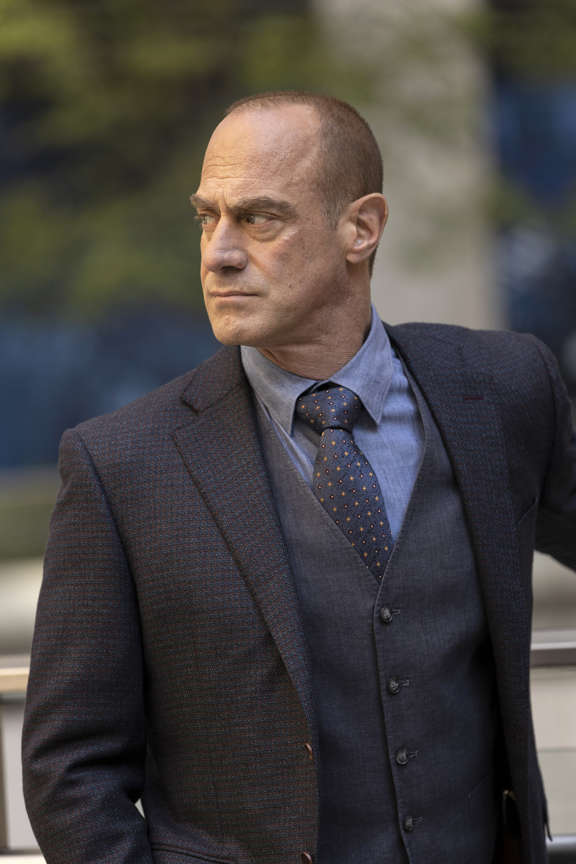 Meloni filming Law &amp;amp; Order Organized Crime in a three-piece suit, looking stern