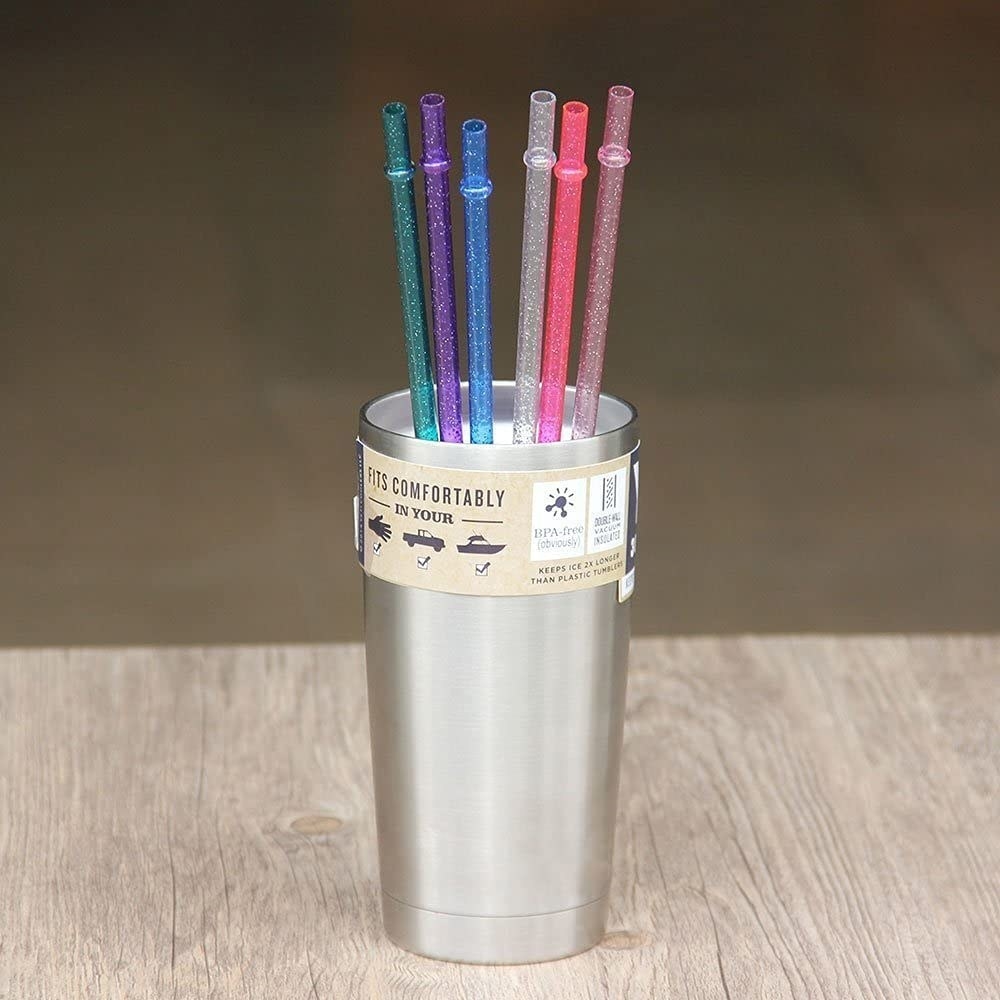 Six straws in a stainless steel tumbler