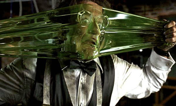 Robin Williams in &quot;Flubber&quot; stretching the slime and making a funny face into it