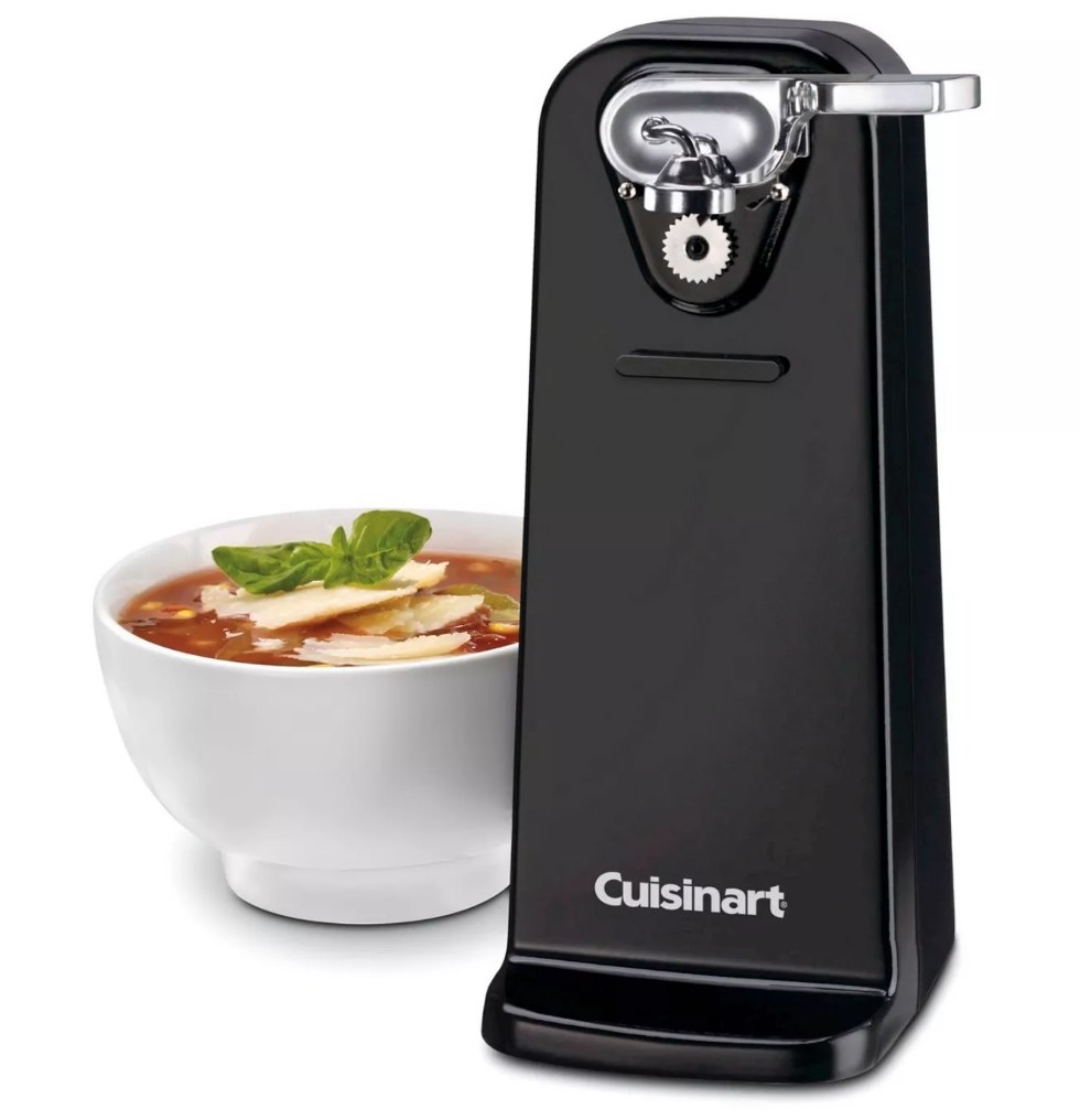 A black, Cuisinart electric can opener next to a bowl of soup