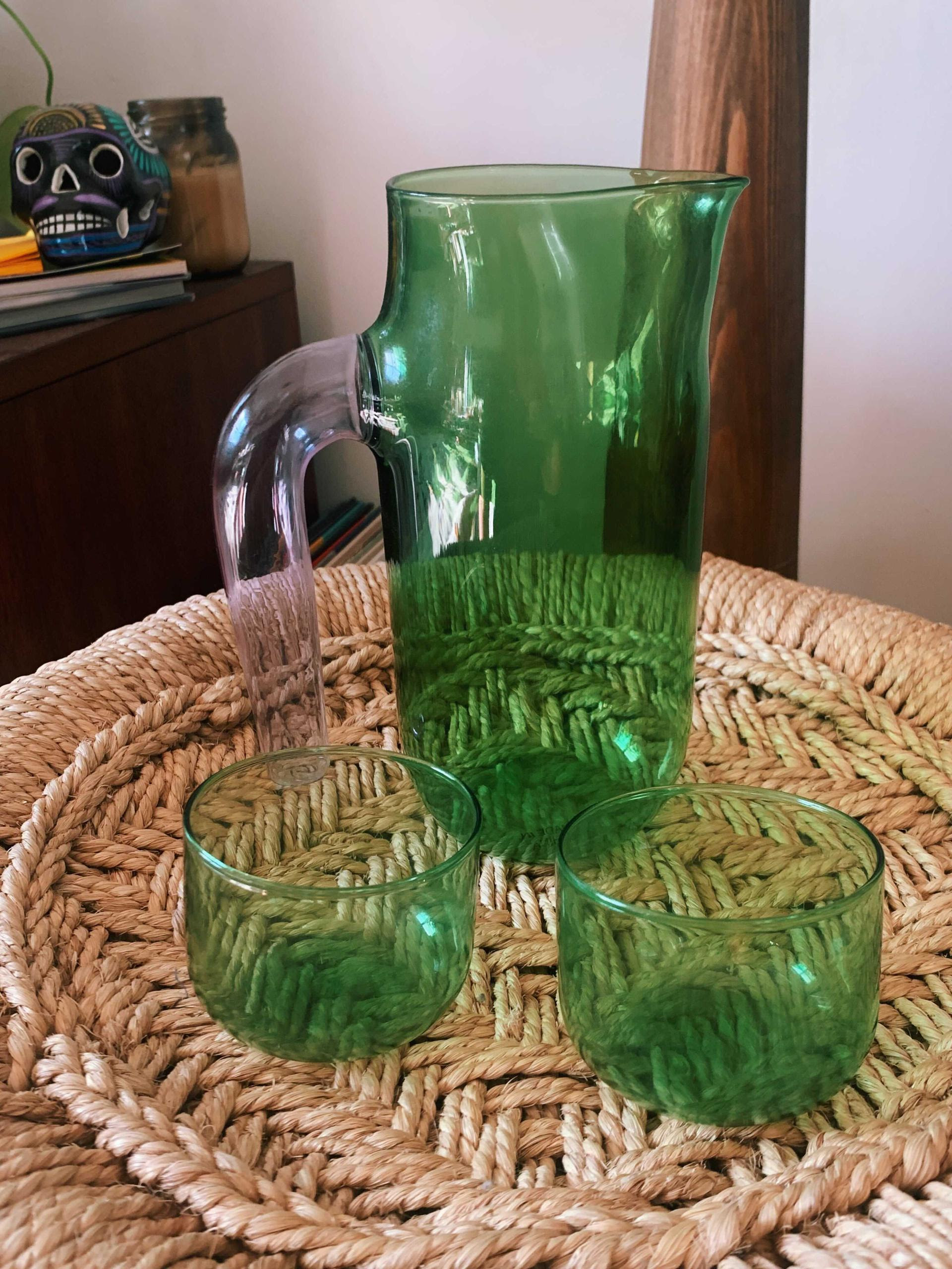 buzzfeeder&#x27;s clear green class pitcher with a clear handle and two short, wide, green glasses
