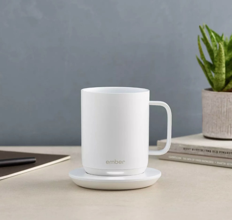 A white, temperature control smart mug with an LED light that indicates when your drink is at the perfect temperature