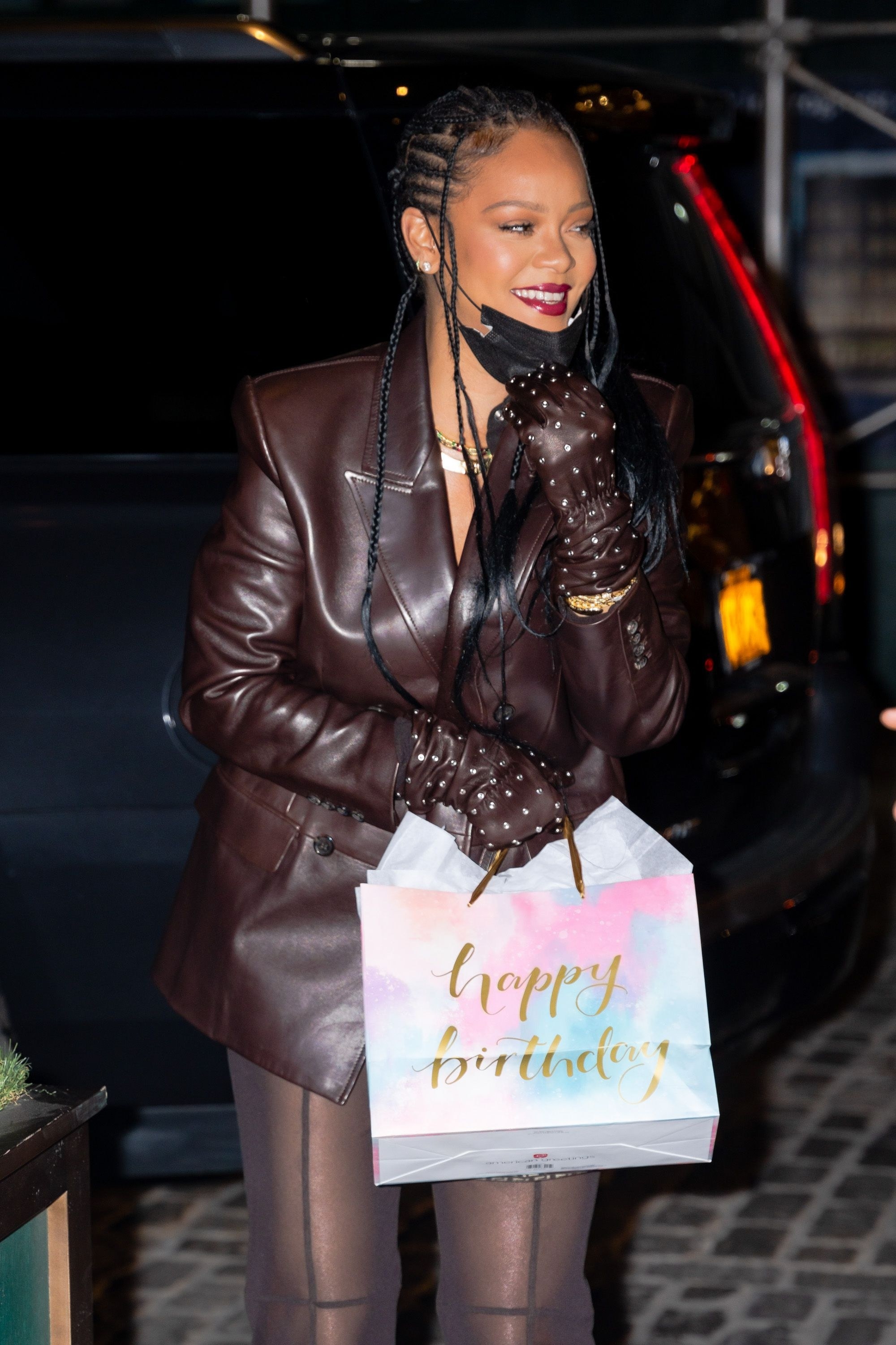 Rihanna is photographed carrying a gift bag in New York City