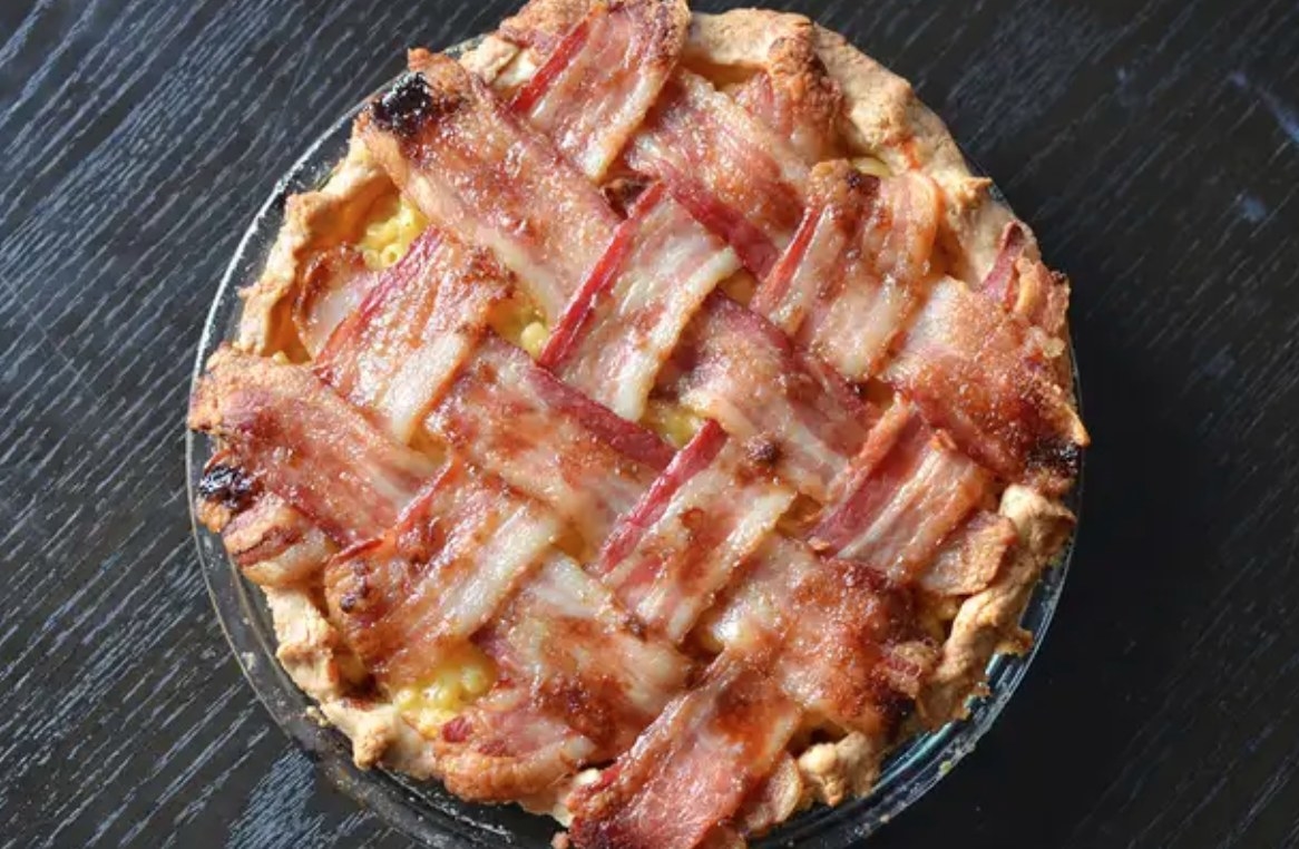 a pasta pie made with pasta inside and bacon on top as a crust