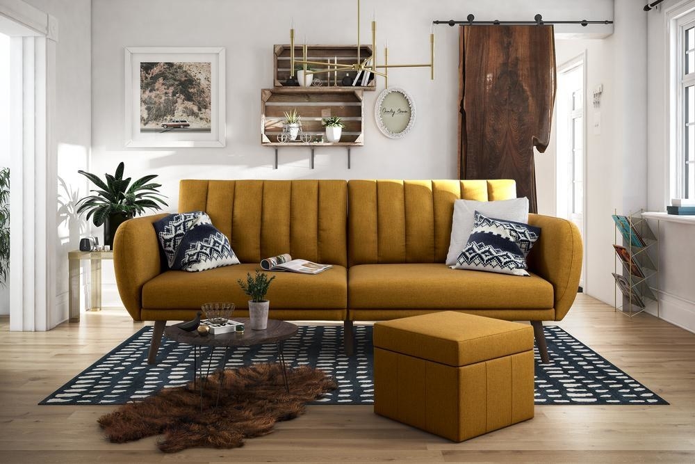 a modern couch in mustard yellow