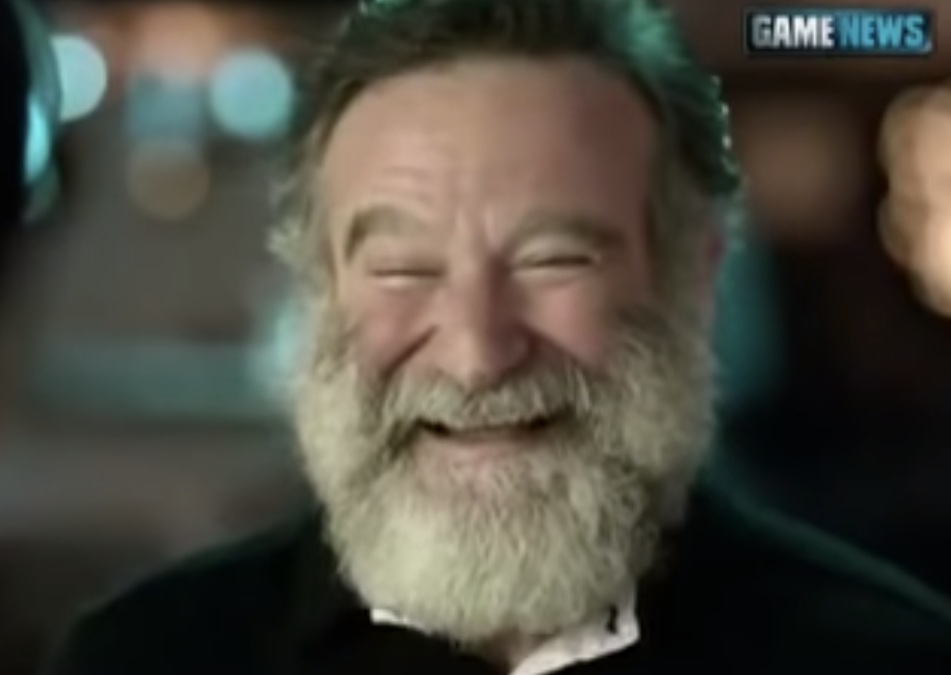 Robin Williams laughing happily in an interview with his daughter for Game News