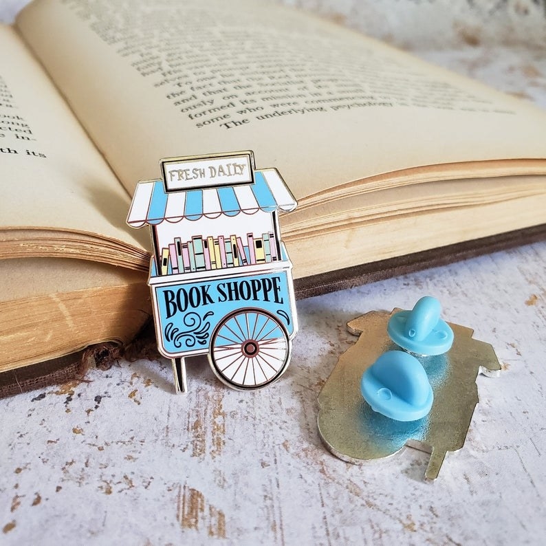 a tiny book shop cart pin