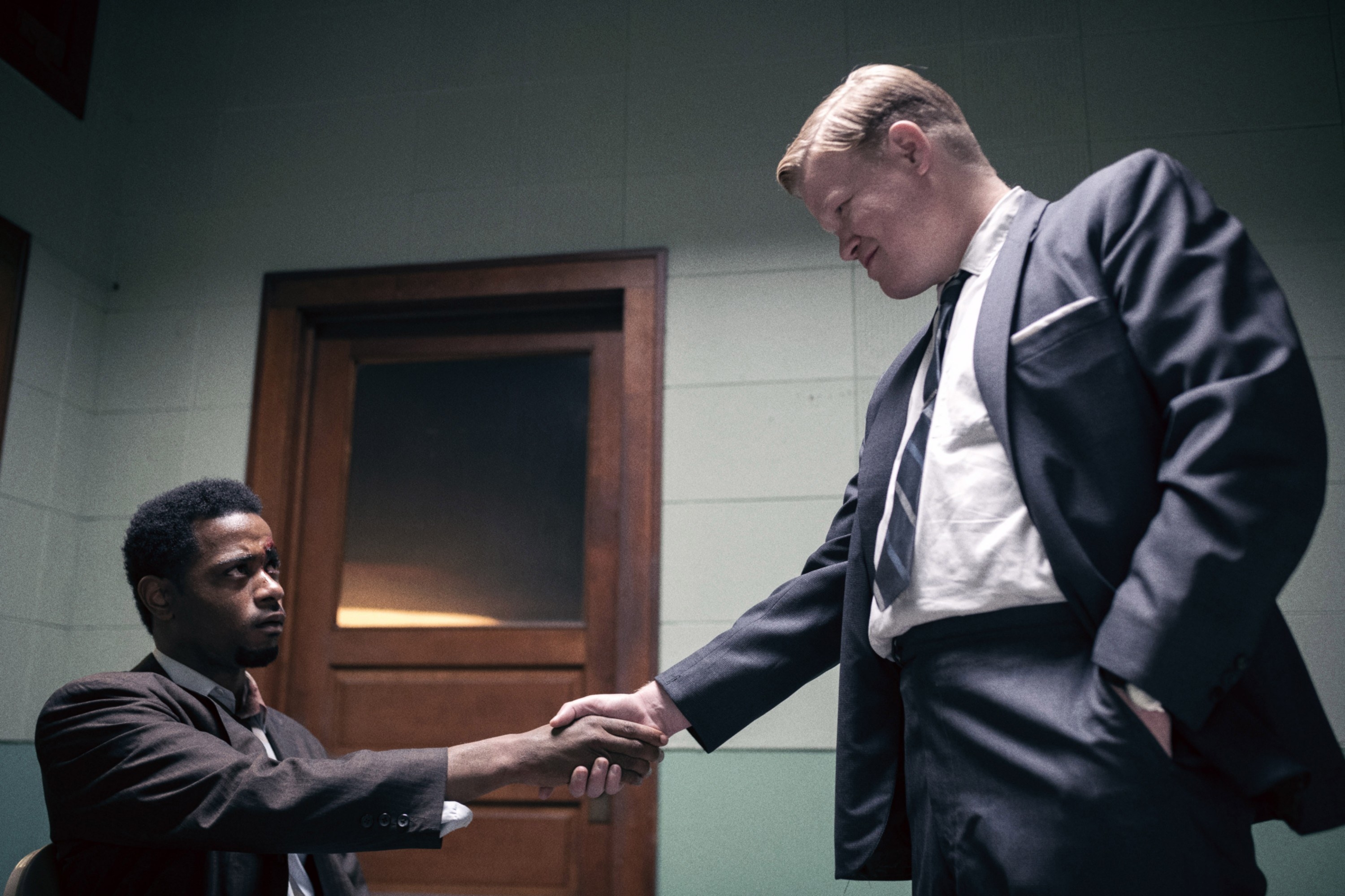 Lakeith Stanfield shaking hands with Jesse Plemons
