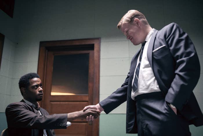 Lakeith Stanfield shaking hands with Jesse Plemons.