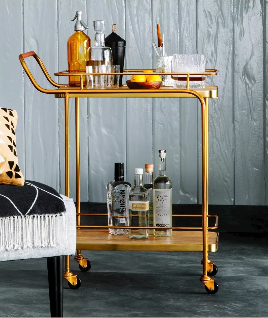 The gold bar cart with two open shelves on wheels