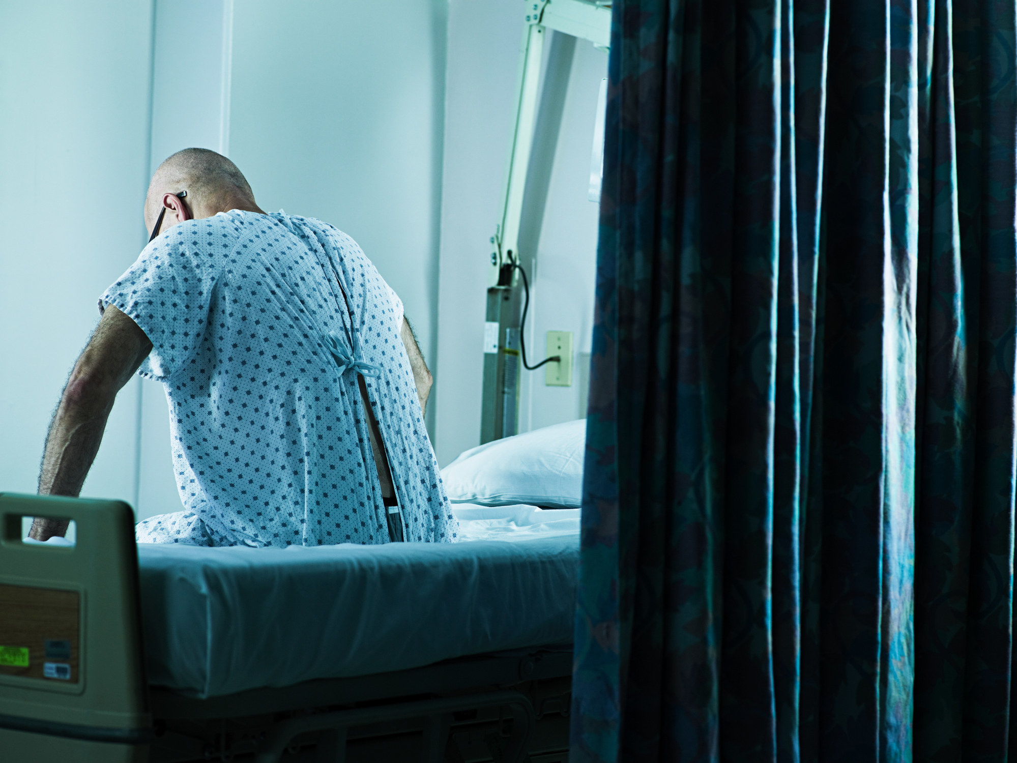 A person sitting in a hospital bed