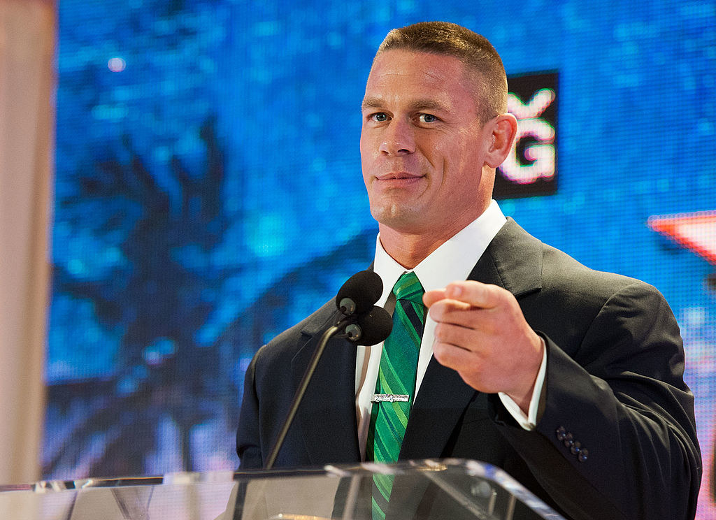 John Cena pointing to the camera at a press event