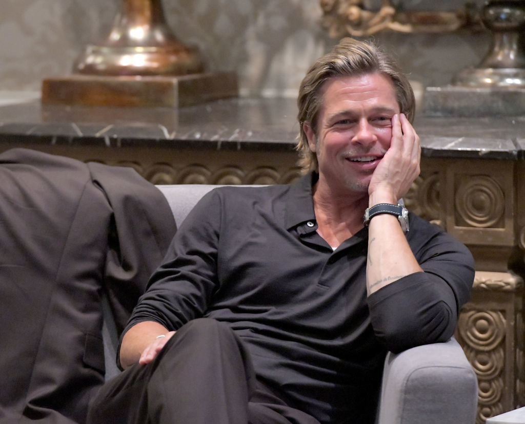 A shot of Brad Pitt with his hand on his face