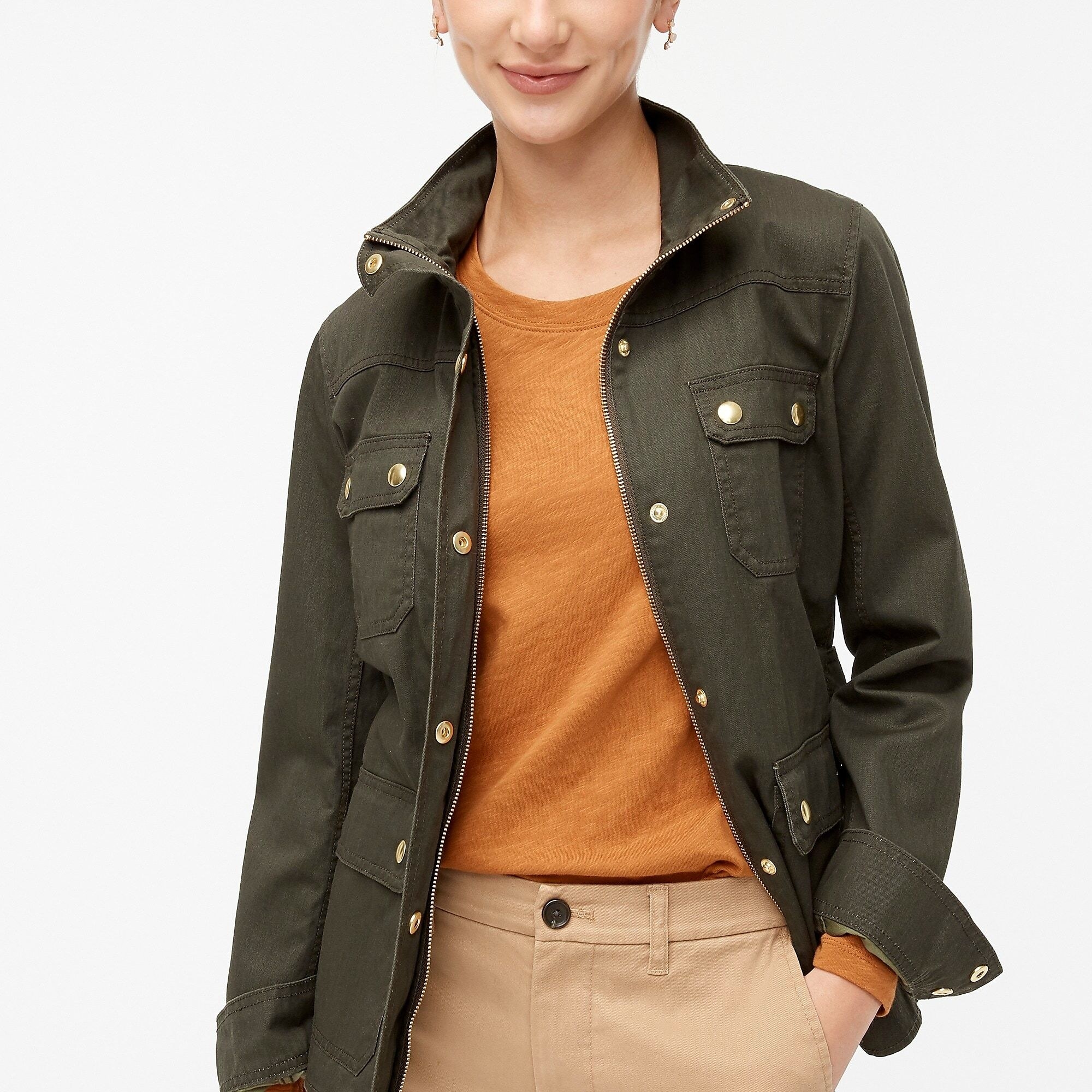 Model wearing the mossy brown resin-coated twill field jacket