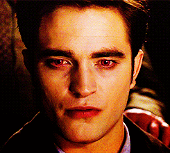 Edward Cullen looks suspicious as he shifts his eyes around to avoid making eye contact with the camera