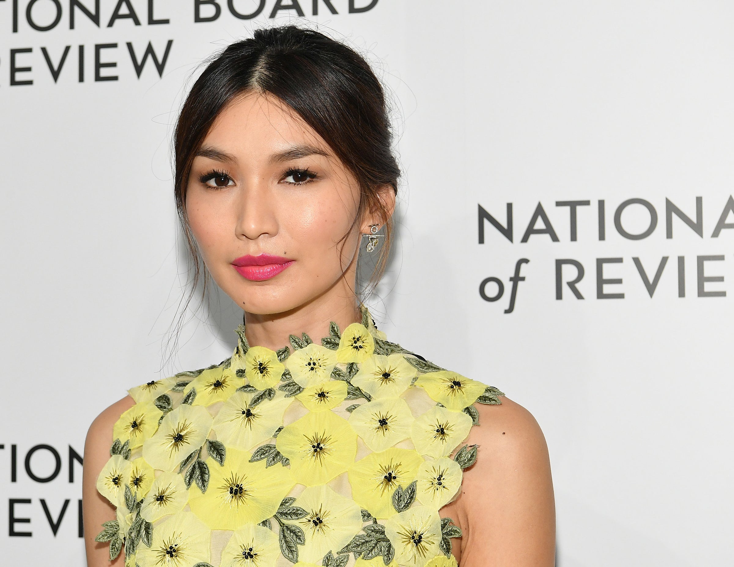 Gemma wears a yellow dress with yellow floral applique