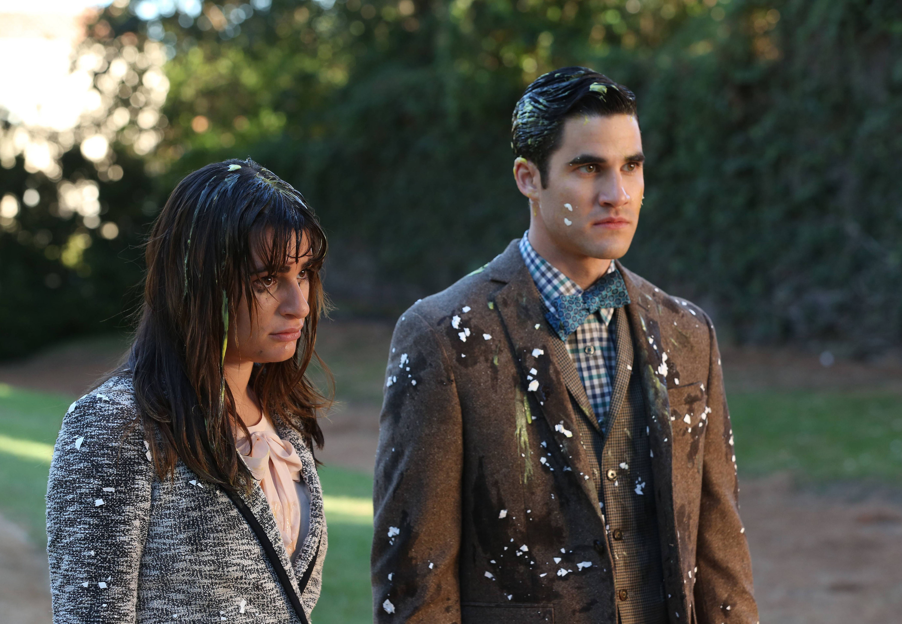 Lea Michele and Criss stand next to each other while covered in slop