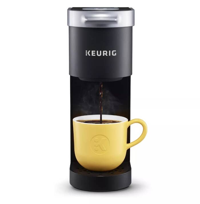 Keurig pouring coffee into yellow mug