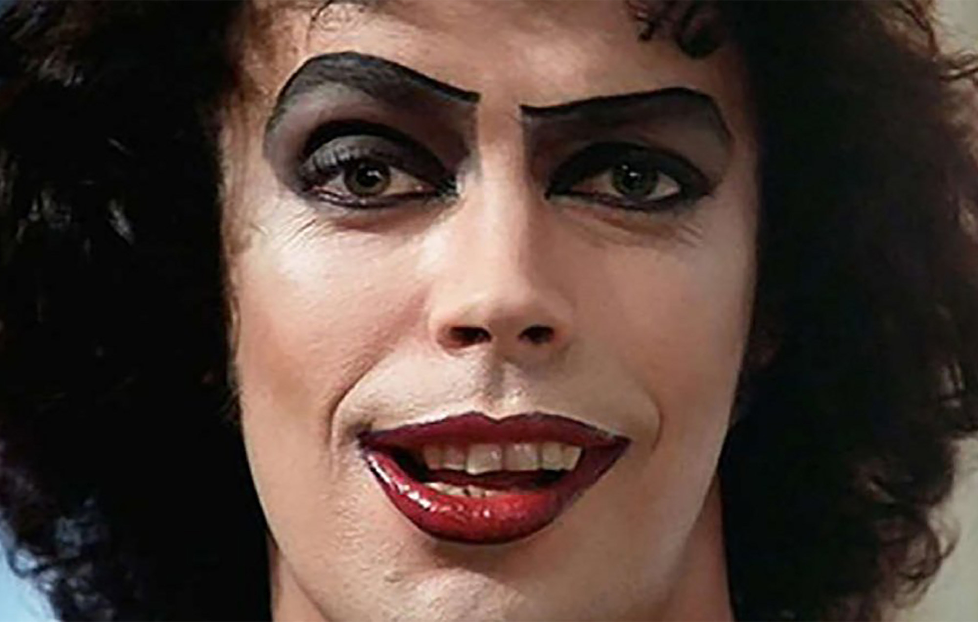 Close up of Tim Curry as Dr. Frank N. Furter in The Rocky Horror Picture Show. 