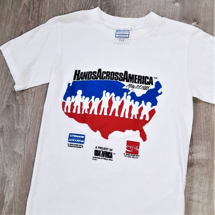 A white Hands Across America T-shirt