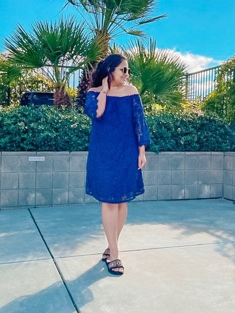 Reviewer wearing blue dress