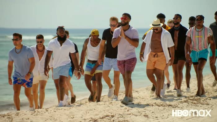 A group of men walking on a beach