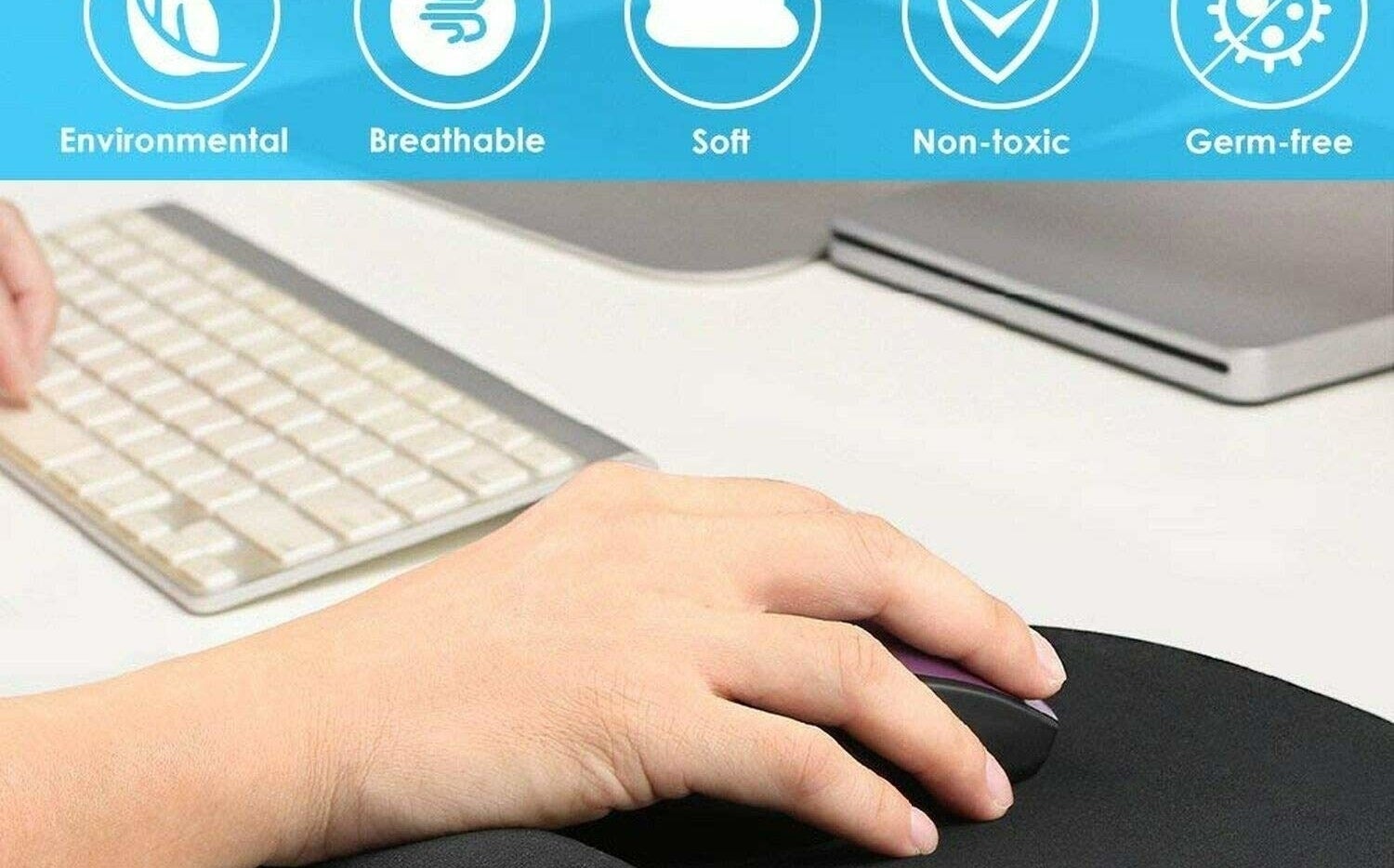 A person using a mouse on an ergonomic pad next to a keyboard