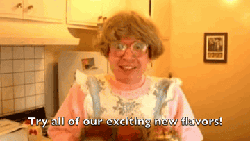 Liam Kyle Sullivan holds up a tray of muffins and says, &quot;Try all of our exciting new flavors!&quot;