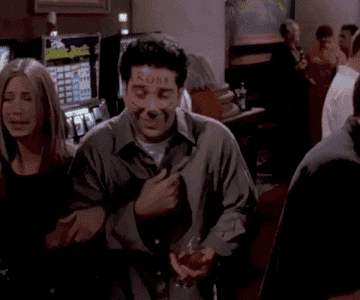 GIF of Ross and Rachel from Friends laughing with marker all over that face