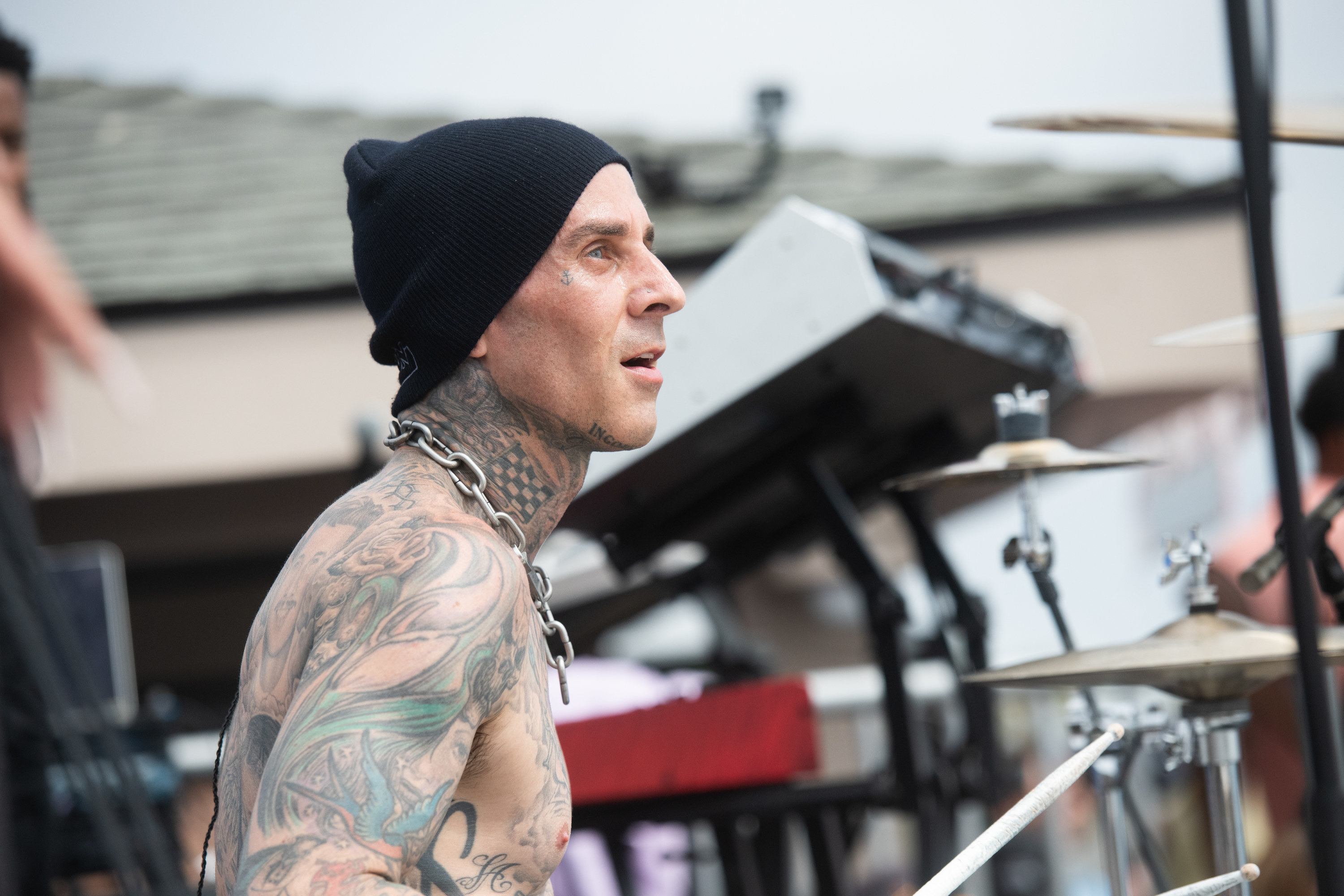 Travis Barker is pictured drumming onstage in Venice, California