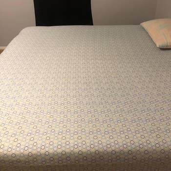 the sheet taught across the bed