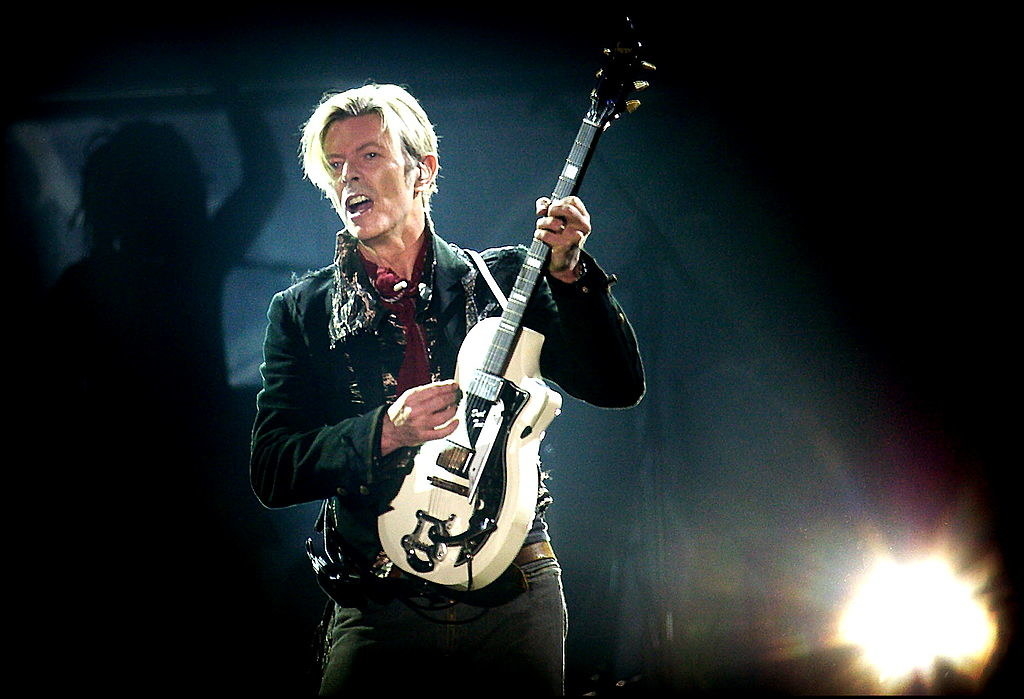 &quot;Under Pressure&quot; singer playing a guitar