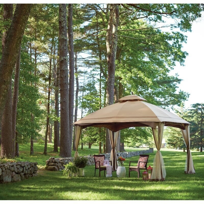 steel and vinyl gazebo with mosquito nets on each leg