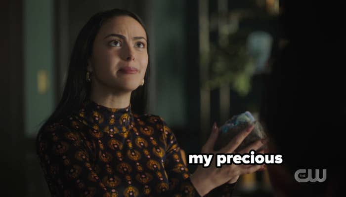 Veronica holding the rock with the caption my precious