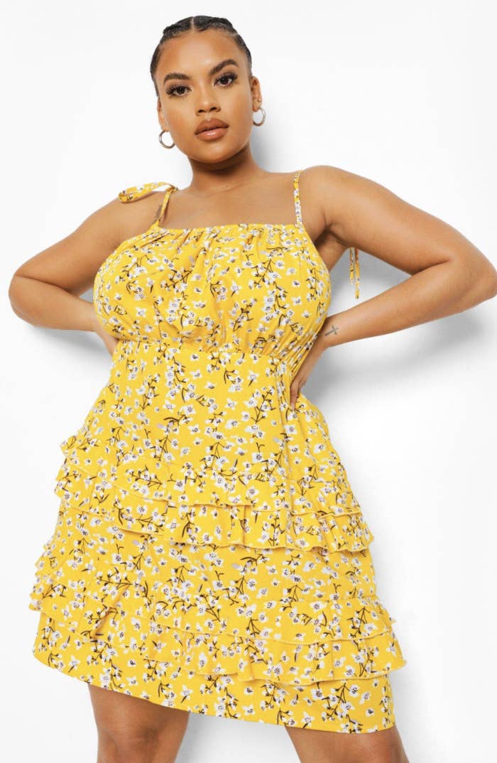 model wearing yellow floral dress
