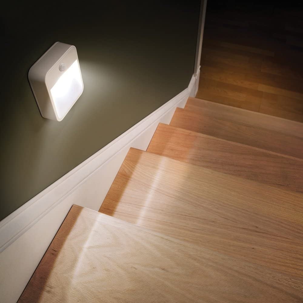 Night lights installed on the staircase wall where there are no outlets