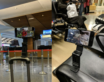 Phone mounted on a carry on luggage handle and a chair arm 