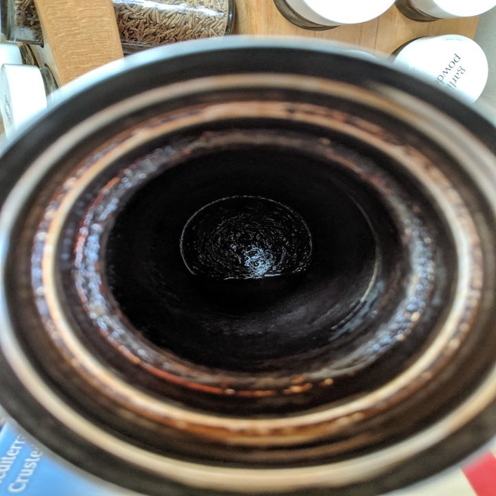 reviewer before image of a bottle that's nearly black inside